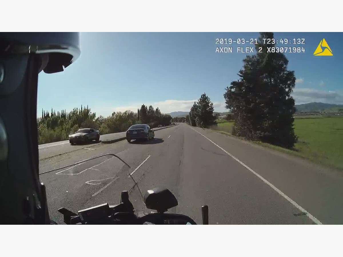 The driver of the Mustang (left) is accused of reckless driving after he was caught going over 100 mph, police said.