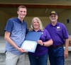 Cameron Kemper (left), Friends' scholarship chair Carrie Hamel and Friends' president Donnie Huffman
