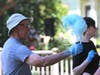 Ned Roscoe and Jane Roscoe give out free cotton candy at Napa Porchfest, July 28, 2019.