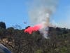 Aircraft drops fire retardant on a fire along Redwood Hill Road in Sonoma County, Aug. 3, 2019.