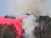 A Cal Fire aircraft makes a drop on a Redwood Hill Road wildfire in Sonoma County, Saturday, Aug. 3, 2109.