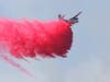 A Cal Fire aircraft makes a drop on a Redwood Hill Road wildfire in Sonoma County, Saturday, Aug. 3, 2109.