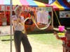 Makaela McDermott, from Napa but living in Redding, makes a giant bubble at the Circus Imagination tent at the 2019 Napa Town & Country Fair.