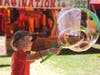 James Gegler, 5, of Napa makes his own super-sized bubble at the Napa Town & Country Fair, Wednesday, Aug. 7, 2019.