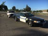Rohnert Park Department of Public Safety vehicles block the entrance to the Roberts Lake Road park-and-ride commuter lot, Aug. 14, 2019.