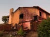 A fire spread from outside a home to the second floor of a two-story residence, Aug. 26, 2019, in Benicia, California.