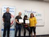 Angelica Rivas and David Cassetta (center) receive Golden Heart Awards, Sept. 26, 2019, from Assistant Petaluma fire Chief Jeff Schach and Tami Bender, with Petaluma Health Care District.