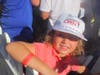 Hayley Due, 5, of Napa smiles big after getting signatures on her hat from Steph Curry and Phil Mickelson.