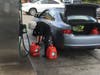 People potentially affected by a fire-weather related PG&E power shutoff in Northern California line up at a Sonoma County gas station to fill their gas tanks and even some containers, Oct. 8, 2019.