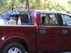 A Healdsburg resident evacuates with his little dog and birds in the back of his pickup truck, Saturday, Oct. 26, 2019.