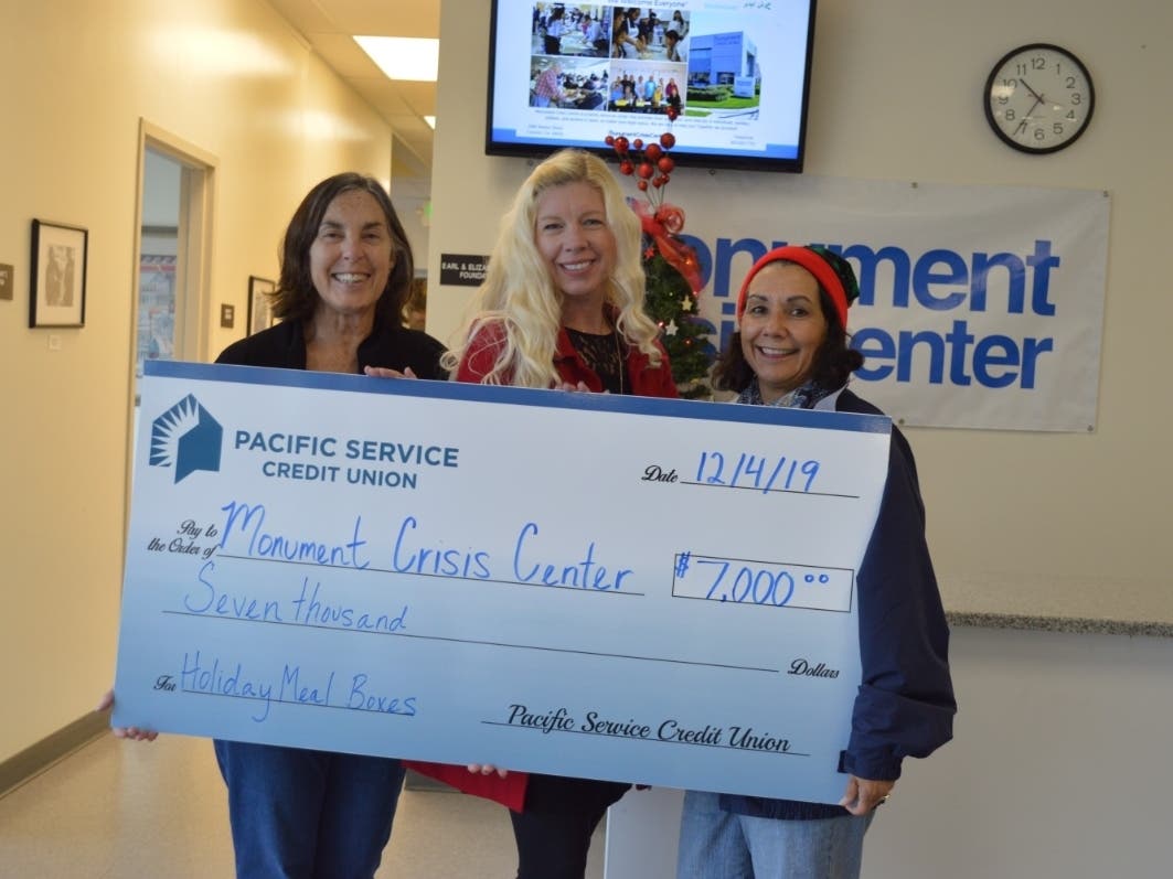 (Left to right) Monument Crisis Center Executive Director Sandra Scherer, Pacific Service Credit Union Business Development Manager Kristin Peterson, and Monument Crisis Center Operations Manager Yolanda Gonzalez