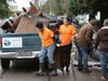 Members of Clean River Alliance were among volunteers helping clear items Wednesday, Jan. 22, 2020, from a homeless encampment along the Joe Rodota Trail that has grown to a population of around 200.