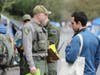 Santa Rosa police, Sonoma County Parks rangers and other local authorities serve legal notices to vacate Wednesday, Jan. 22, 2020, to all occupants of a sizable homeless encampment along the Joe Rodota Trail.