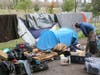A homeless man who along with hundreds of others was served a notice to vacate the Joe Rodota Trail surveys the contents of his makeshift shelter on the Joe Rodota Trail, which runs parallel to state Highway 12 in Santa Rosa.