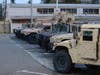 California National Guard armored vehicles are pictured Tuesday at a National Guard armory in Santa Rosa, California. Gov. Gavin Newsom put the California National Guard on alert Tuesday in the event troops need to mobilize amid the coronavirus crisis.