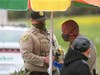 Sheriff's deputies cite a worker at a roadside fruit stand on suspicion of not following the protocols of Sonoma County's coronavirus-related public health order.