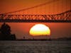 The sun sets behind the Carquinez Bridge, Benicia, California.