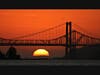 The sun sets behind the Carquinez Bridge, Benicia, California.