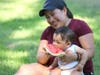 Eight-month-old Matias Merida was more interested in a nice, perfect watermelon with his mother, Dina, of San Rafael during a visit to the Russian River Saturday in Healdsburg.