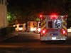 Ambulances line up Wednesday night to evacuate St. Helena Hospital from the LNU Lightning Complex fires.