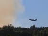 A large air tanker prepares to make a drop on the Walbridge Fire near Lake Sonoma, Aug. 21, 2020.