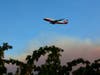 An air tanker flies over the Walbridge Fire west of Healdsburg in Sonoma County.