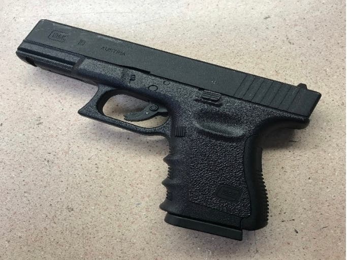 This replica gun was recovered from the suspect's car, police said.