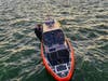 A U.S. Coast Guard crew responds to rescue a capsized boater Wednesday in the waters off Rodeo.
