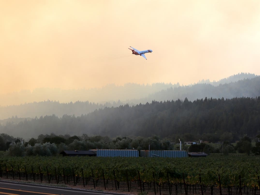 An air tanker fights the Glass Fire from above. Combined, more than 900 Napa Valley homes, wineries and other businesses were destroyed in the 2020 Hennessey Fire and Glass Fire.