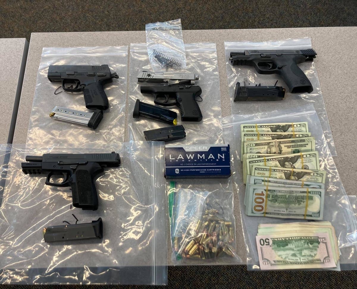 The four pistols, $16,000 in cash, and ammunition pictured above were recovered Monday night from a convicted felon in Windsor, the Sonoma County Sheriff's Office said.
