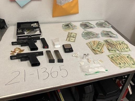 Petaluma police said the guns, drugs and cash shown above were seized April 9 in a search of Andres Marquez's person and car.