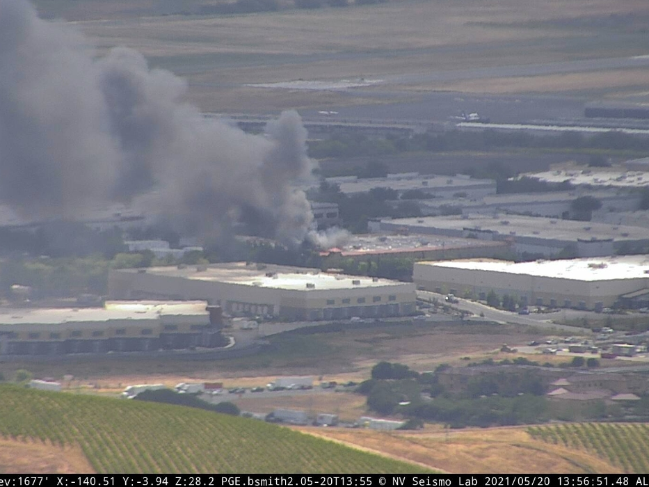 Smoke billows from a fire Thursday afternoon at a commercial building near the Napa County Airport.