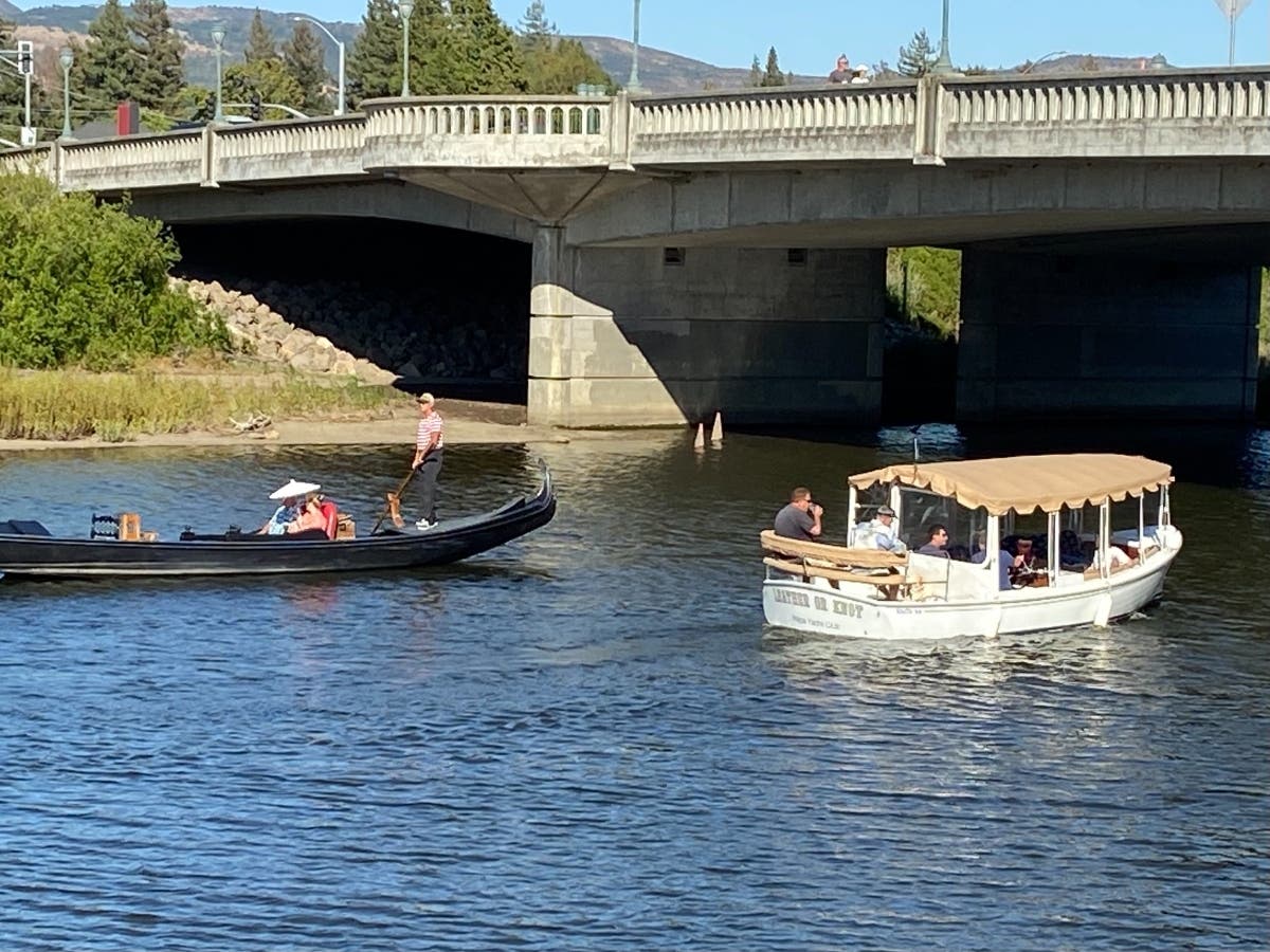 Guests take a gondola ride Saturday, June 26, on the Napa River, while another group takes a spin on a private boat out of the Napa Yacht Club.