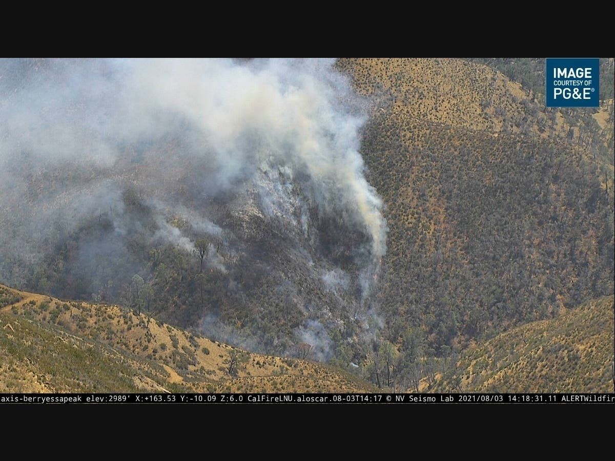 The Eastside Fire burns Tuesday afternoon in rugged terrain east of Lake Berryessa in Napa County.