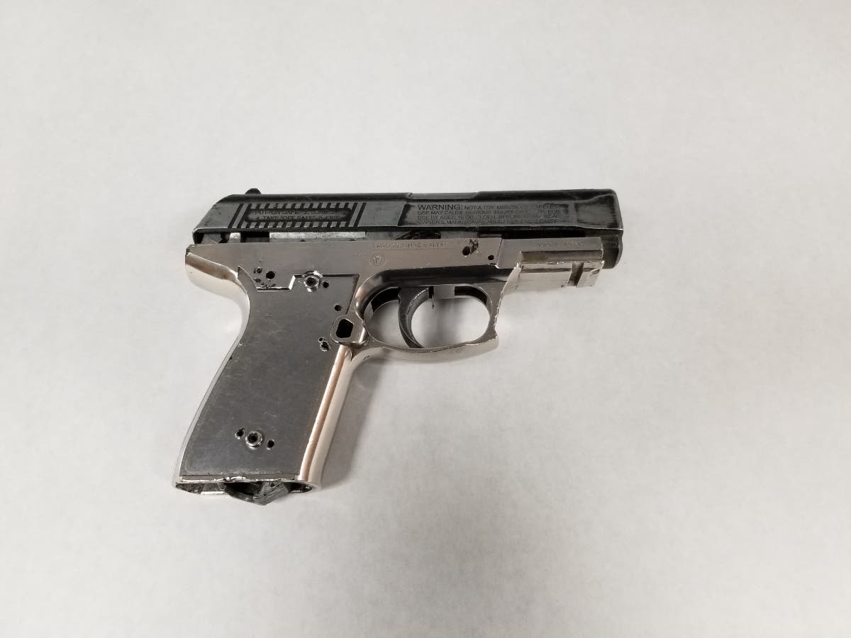 Officers recovered a pistol wrapped in plastic (later determined to be a Co2 BB gun, not a firearm) in a search of an attempted robbery suspect's camp site, police said.