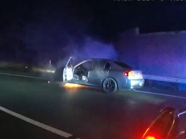 An Infiniti sedan catches fire during a police chase down U.S. Highway 101 from Santa Rosa to Cotati.