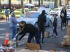 Volunteers hand out Thanksgiving meals complete with turkeys Sunday at the Napa Expo.