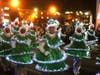 Tap-dancing Christmas trees take part in the 2021 Napa Lighted Christmas Parade.