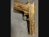 Santa Rosa police said this gold-plated Colt 9mm Luger handgun was among the firearms recovered in a search Wednesday of a Rohnert Park man's home.