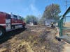 Firefighters battle a 3-acre vegetation fire Tuesday in Pittsburg.
