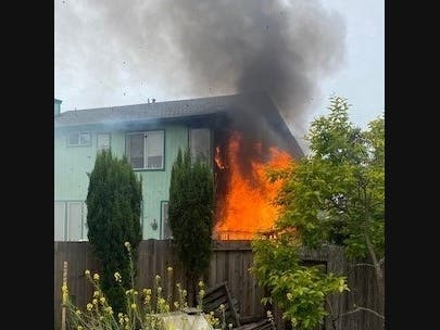 A fire burns Thursday at a home on McNair Court in Rohnert Park.