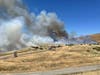 A vegetation fire erupts Friday along Willow Pass Court in Concord.