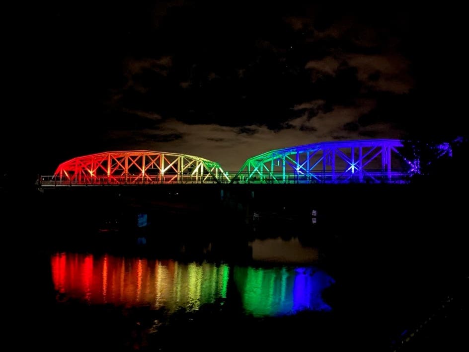 The Healdsburg Avenue Bridge is illuminated for the month of June 2022 in the colors of the Pride Flag.