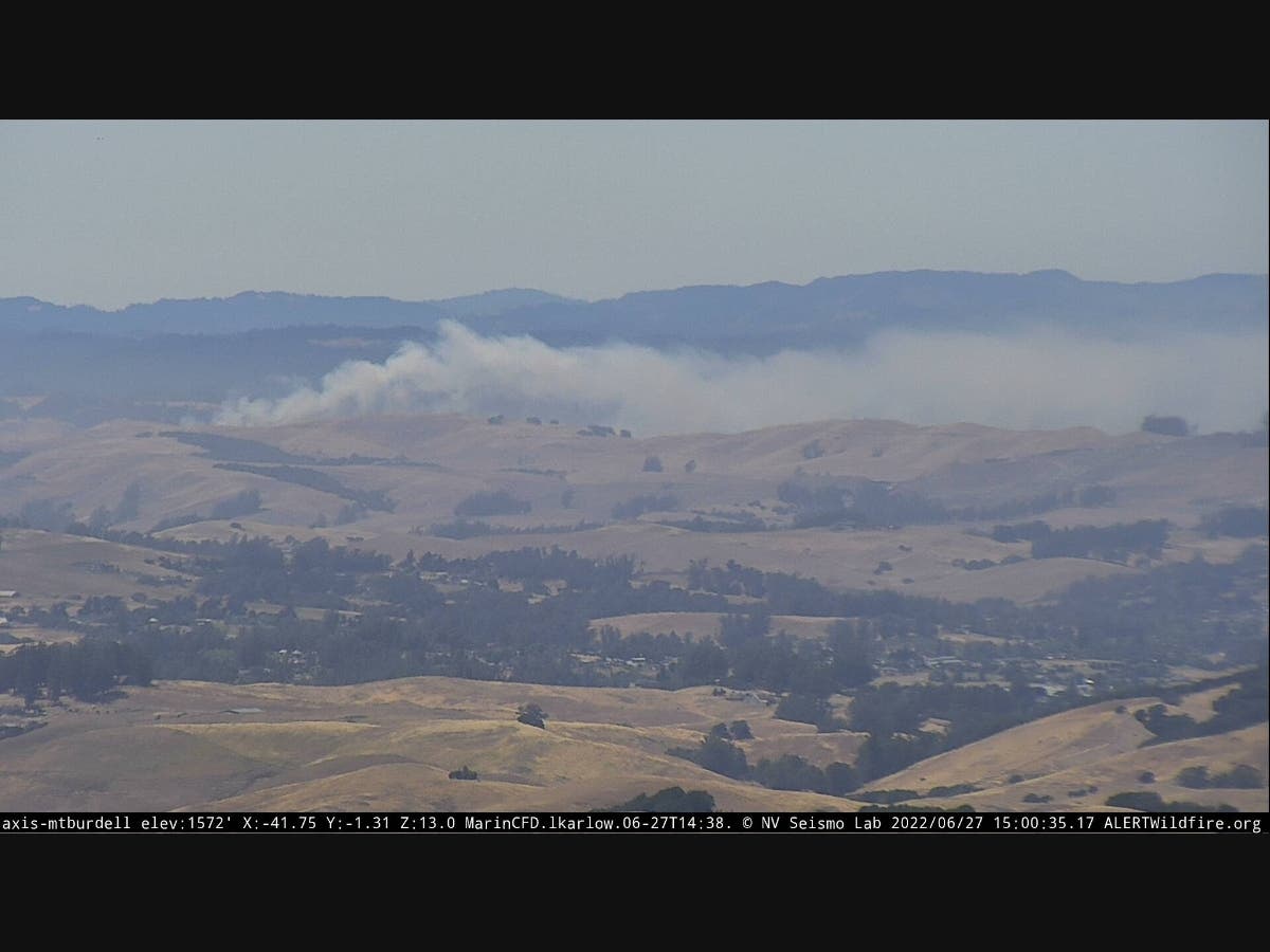 Smoke billows from a grass fire Monday afternoon in an unincorporated area of Sonoma County west of Rohnert Park.