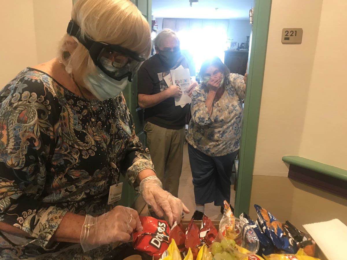 Staff member picks out goodies to deliver to residents at Chelsea Jewish Lifecare