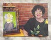 Sandra with one of her paintings