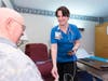 Elise Krotky checks the vital signs of a Jefferson House resident.