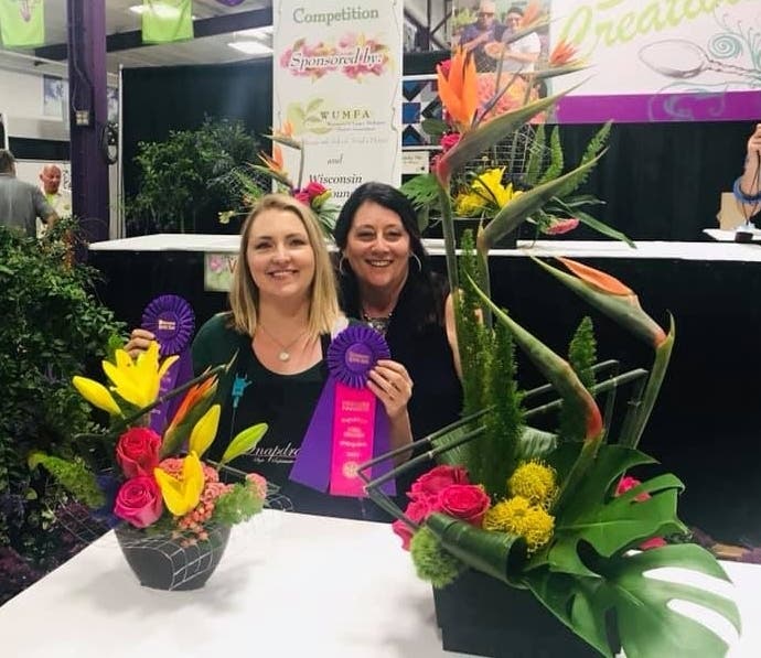 Jenn Breitbach (left) and Rhonda Deaver, owner of Snapdragon Flowers of Elm Grove, with Jenn's award-winning arrangments