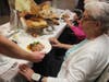 Josephine Rodriguez reacts to her Chef's Table entree at Peace Village. 