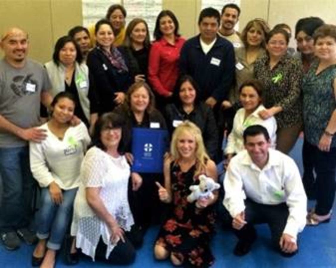Dr. Marisol Munoz-Kiehne (bottom, center), Marin HHS psychologist, poses with staff from North Marin Community Services.